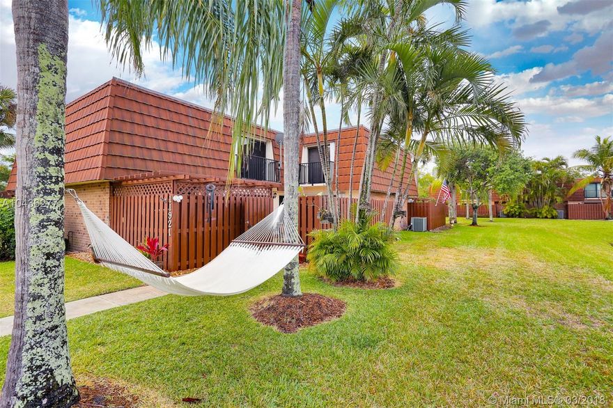 Welcome home to this magnificent townhome. Located in a sought-after community and minutes from major highways. This lakefront property conveniently features one bedroom downstairs with french doors that could be used as an office or a den. Beautifully updated kitchen, large Living room with lake views, tile floors throughout, all remodeled bathrooms, 2nd floors is all concrete and tiled throughout, large Master Bedroom with its own balcony and fantastic forever views of the lake. Stunning remodeled Master Bathroom, accordion shutters, freshly painted large fenced patio . This townhome is an A+ and will not last!