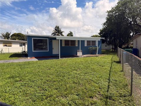 Photo of 318 NW 30th Ter, Fort Lauderdale, FL 33311 (MLS # A12007649)