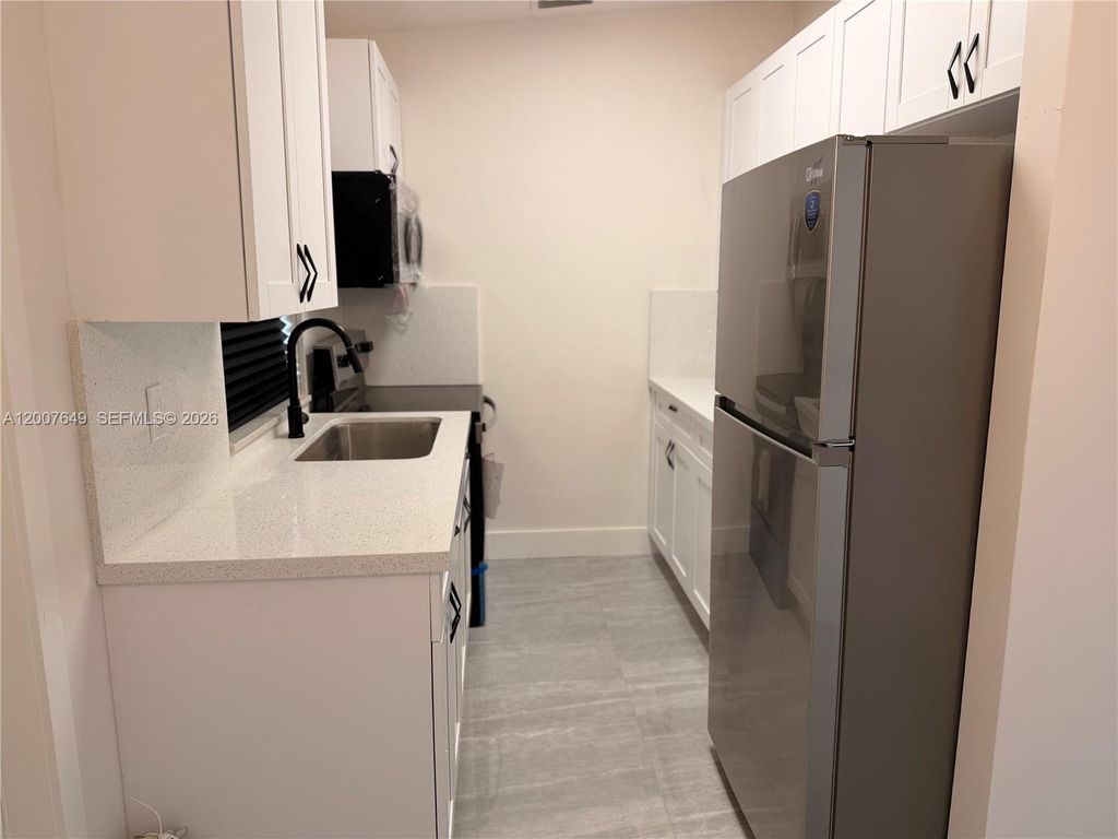 Photo of 318 NW 30th Ter, Fort Lauderdale, FL 33311 (MLS # A12007649)