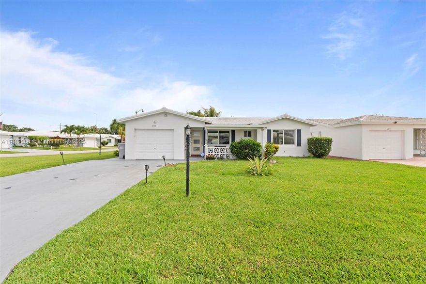 Discover this charming 2/2 home situated on a lovely corner lot with a garage, a cozy front porch, and a rear patio, perfect for relaxing or entertaining guests. The home offers a new roof, high-impact windows throughout for added peace of mind. Inside laundry/ utility room adds convenient storage. This 55+ community.  Monthly HOA is $274 and covers water, sewer, lawn care, exterior painting, a community shuttle, and more. Pets are allowed. Residents enjoy a range of amenities, including a 9hole golf course, two pools, clubhouses, and numerous activities, perfect for an active lifestyle!