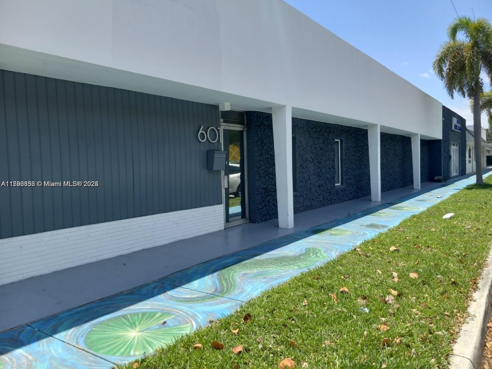 Discover a bright and spacious 5,200 SF commercial property just moments from Hollywood’s vibrant Young Circle. This flexible layout offers an expansive open floor plan, perfect for a showroom, creative workspace, or multi-use flex space. With high visibility and easy accessibility, it’s an ideal location to bring your vision to life—whether for retail, design, or professional use. Take advantage of this prime location in the heart of one of South Florida’s fastest-growing areas.