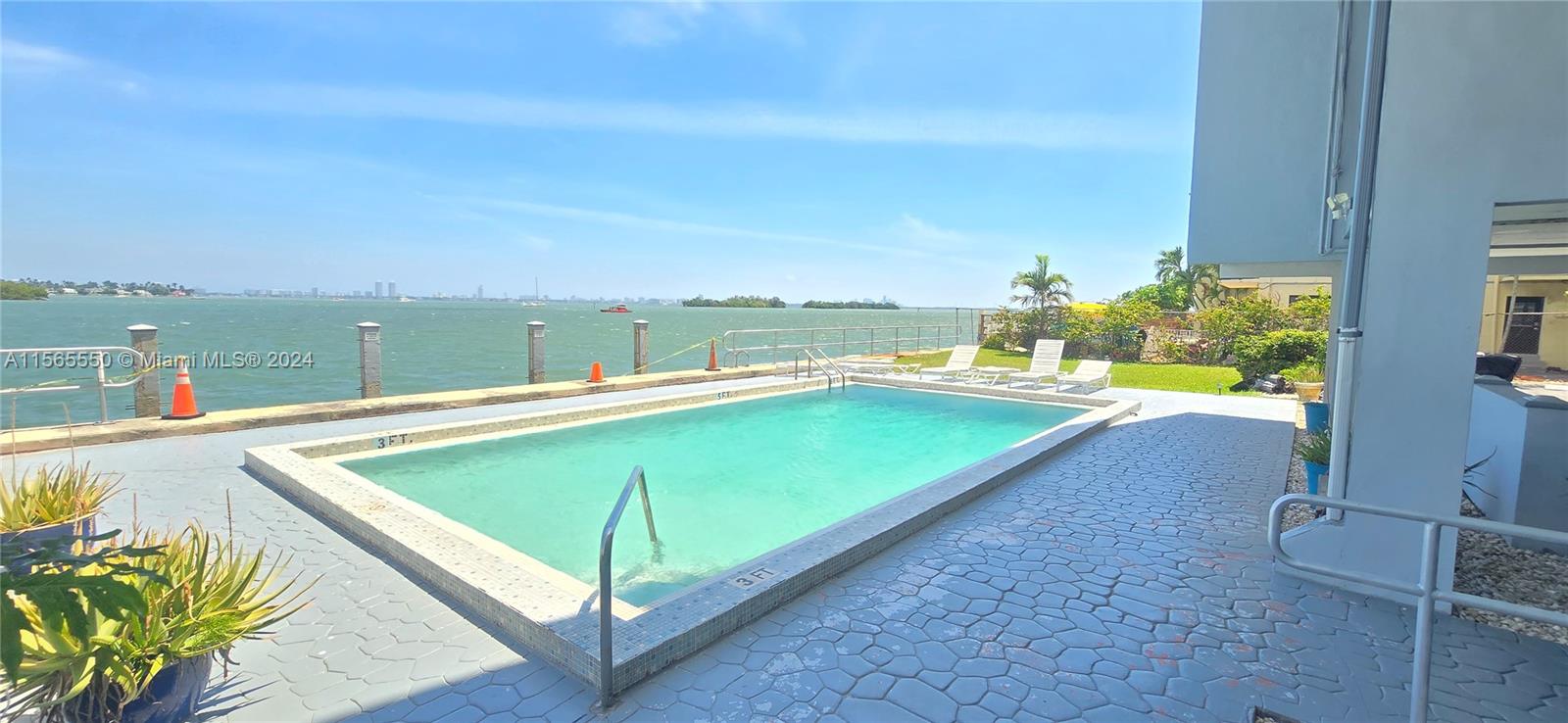 GREAT LOCATION WITH MILLION DOLLAR VIEWS! This condo apartment entirely remodeled features 2 bedrooms and 2 full bathrooms in-suit, plenty of closet, Mexican-style tile floor throughout the unit, open kitchen with granite countertops and stainless steel appliances, renovated bathrooms and a large wraparound balcony with SPECTACULAR unobstructed water views of Biscayne Bay what makes this apartment a unique gem rare to find. Las Olas Condominium is strategically located next to the bridge to North Bay Village, less than 2 miles from the beach, a few minutes driving from the corridor of Biscayne Bldv. and close to restaurants, shopping, schools, supermarket, malls and much more.