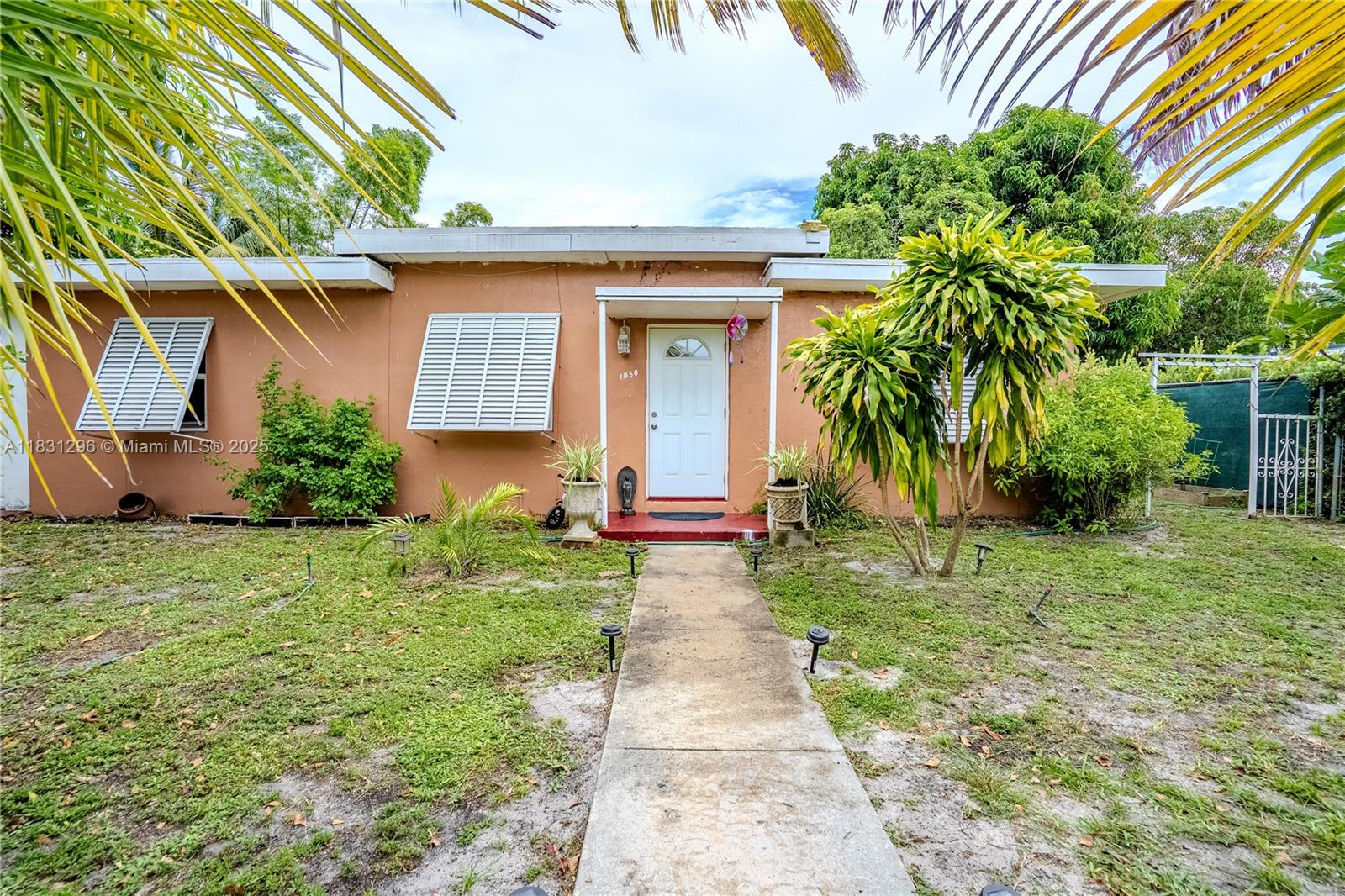 Spacious and well-maintained 3-bedroom, 1.5-bathroom home in a quiet Miami neighborhood, with potential to convert into a 4-bedroom, 2-bathroom layout. The garage could be transformed into an additional bedroom, and there's an existing half bath conveniently located near the laundry area. The home features a formal dining room, a large family room that can also serve as a third bedroom or office, a screened patio ideal for relaxing, and an open patio perfect for entertaining. Other highlights include a one-car garage, a utilities room, and a fully fenced backyard with various fruit trees, a garden area, and a designated lounge space. A separate work area with a private entrance offers added flexibility. An excellent opportunity for homeowners or investors alike.