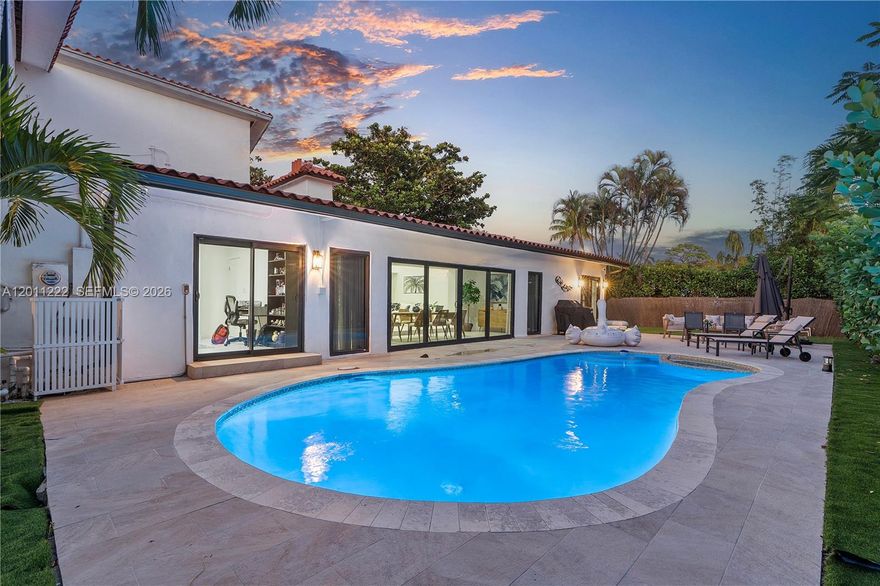 Experience modern luxury with a touch of timeless style in the heart of Miami Shores. This stunning, fully updated home spans nearly 4,000 square feet on an 11,500-square-foot corner lot, offering expansive living spaces, an open-concept layout, and soaring ceilings that flood the interiors with natural light. The main-floor primary suite includes a spa-like bathroom and generous walk-in closets, while the home’s five bedrooms feature large, comfortable layouts ideal for family and guests. A beautifully modernized Art Deco aesthetic flows throughout, highlighted by charming architectural details—including a Juliet balcony that adds character and charm. The contemporary kitchen comes equipped with modern appliances including a dishwasher, and the home also features in-home laundry and a two-car garage. Outdoors, enjoy a private below-ground pool and ample yard space perfect for entertaining or relaxing.