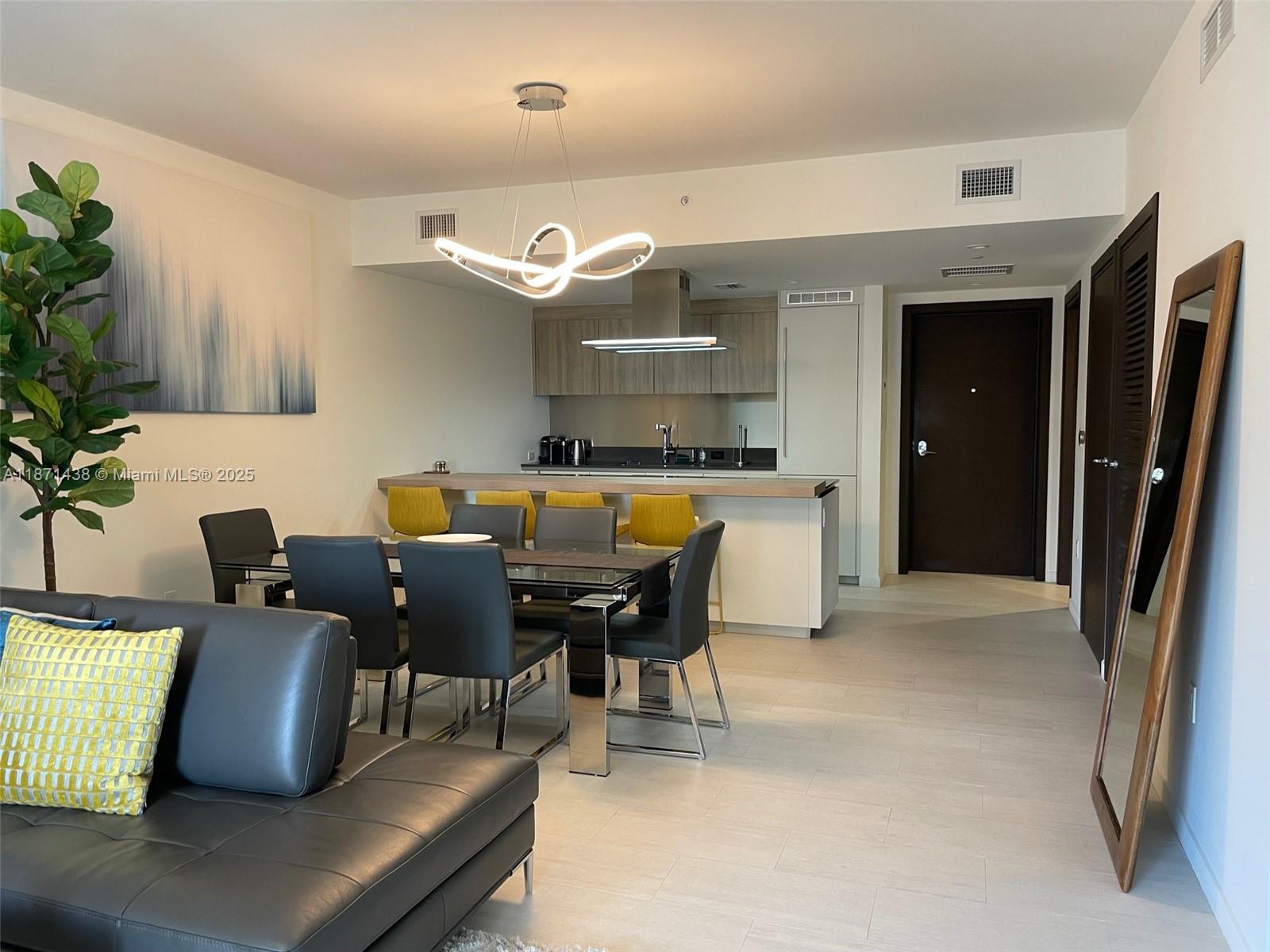 Beautifully furnished 1 bedroom, 1.5 bathrooms apartment in Flatiron - a luxury residential tower in Brickell - Miami's financial district. Top of the line Miele appliances, blackout window treatments and custom finished closets. King bed. Home is complete with kitchen utensils, cutlery and crockery. Building has phenomenal amenities including roof top pool, gym, spa, sauna, jacuzzi & steam room. Has private movie theater, billiards room, children's play area and second pool. Very secure with full time door man and 24 hour concierge. Great location to enjoy the best of Miami with restaurants, shopping and night life all within walking distance.