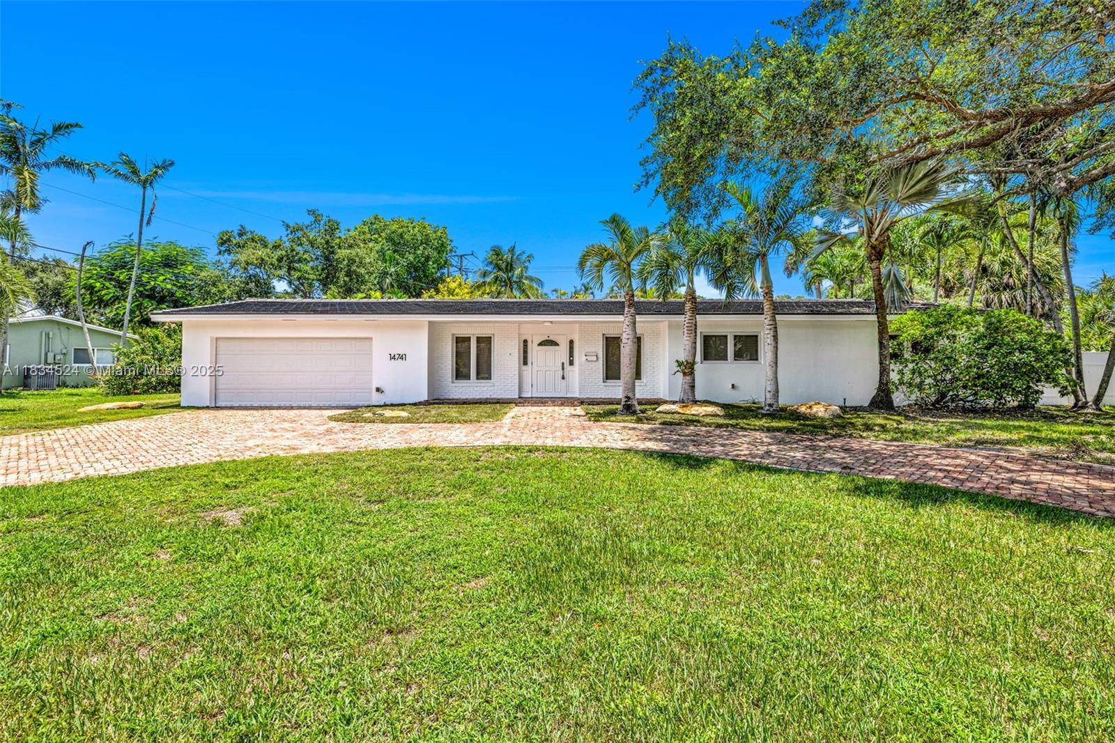 Welcome to this stunning 3/2 home located in the highly sought-after Mangowood neighborhood. Situated on a spacious 15k SF. corner lot, this property offers privacy, comfort, and modern upgrades throughout.Step inside to find wood floors that flow seamlessly through the home, along with recently renovated bathrooms that combine style & functionality. Enjoy the South Florida lifestyle with your own private pool, complete with a large, covered patio and screened enclosure—perfect for relaxing year-round. Additional features include plantation shutters, a two-car garage, impact windows & doors for peace of mind, and access to top-rated A+ schools, making this an ideal choice for families. This move-in-ready gem is a rare find in a prime location. Available NOW, Pool and Lawn Maintenance incl