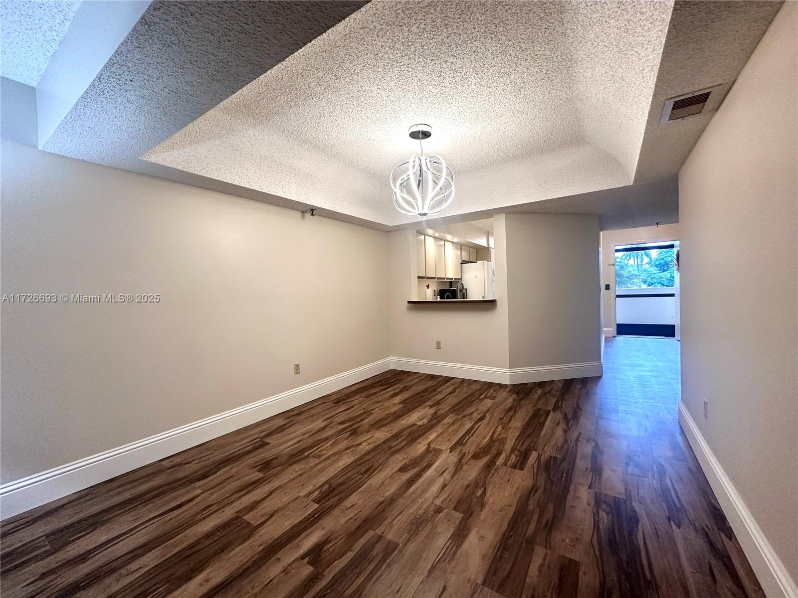PRICED TO SELL! 2-bed, 2-bath condo in Boca Barwood. Recently painted with new luxury vinyl plank floors, a new chandelier, garbage disposal, accordion shutters, and updated bathrooms. Enjoy the convenience of laundry in the unit and extra storage on the patio. Close to shopping, golf, and dining. Includes one assigned covered parking spot with additional parking available.
