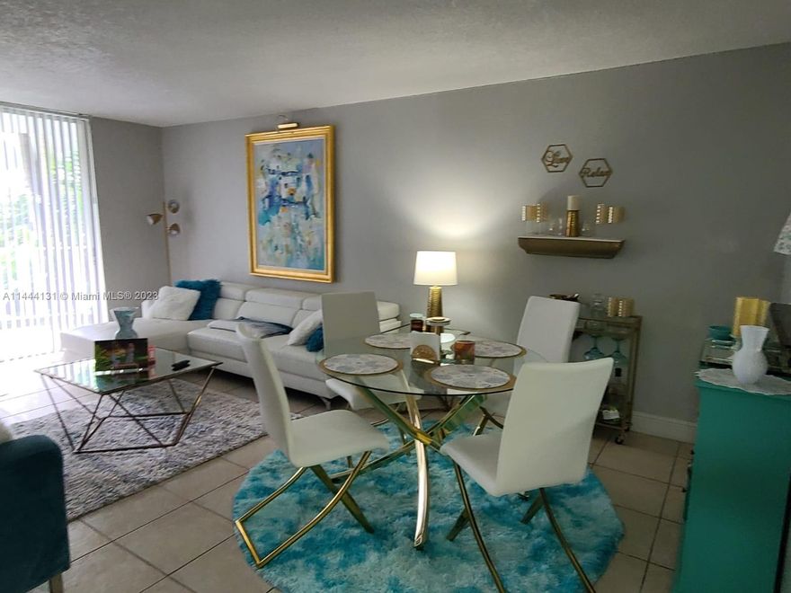 GREAT INVESTORS OPPORTUNITY. RENOVATED FIRST FLOOR UNIT WITH TERRACE. Large 2B+2B property in North Miami. Tile on the entire unit, Kitchen renovate, New Refrigerator, NEW CENTRAL A/C, closets glass doors, fresh paint. Gated Community with a Security guard at Gate, Amenities include Laundry Room, Fitness Center, Olimpic Pool, Tennis CT.  HOA includes water and sewer. Centrally located right off of 163 Street. 2 mint to I-95 & Pallmetto - Minutes from Aventura Mall - Sunny Isles Beach.