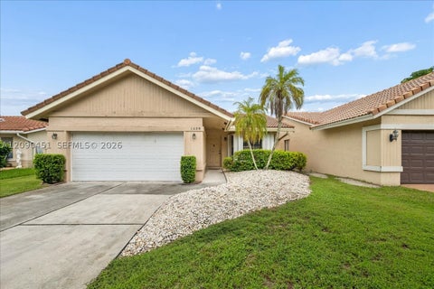 Photo of 1459 NW 97th Ter, Coral Springs, FL 33071 (MLS # A12090451)