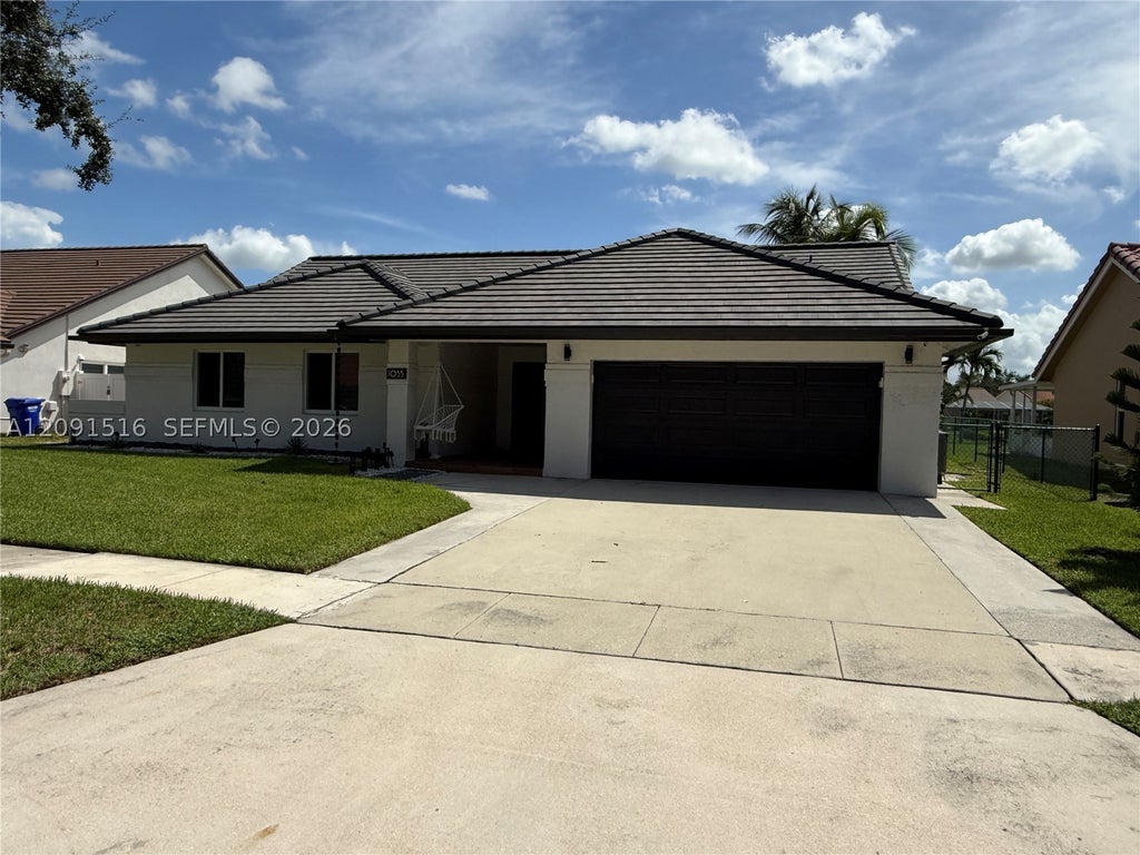 Photo of 1035 NW 164th Ave #0, Pembroke Pines, FL 33028 (MLS # A12091516)