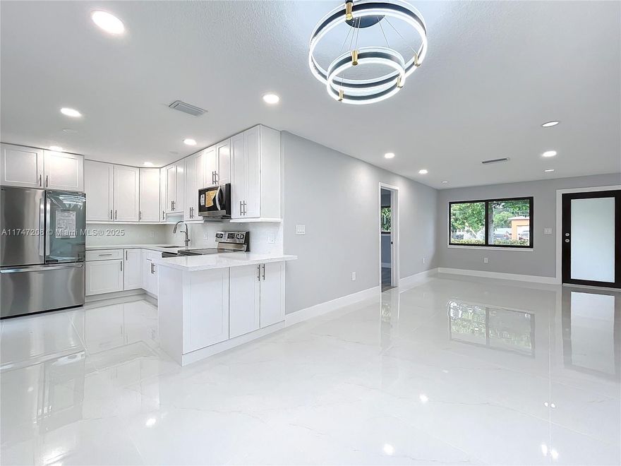 ***UPDATED 4 BEDROOM / 2 BATHROOM GORGEGOUS NEW PORCLIEN FLOORS, VINYL WOOD FLOORING IN THE BEDROOMS,2 AMAZING TILE BATHROOMS, OPEN KITCHEN WITH NEW APPLICANCES, IMPACT WINDOWS & DOORS, NEW AC CONDTIONER & BLUE TOOTH THEMOSTAT, UPDATED ELECTRIC PANEL BOX, NEW WASHER/DRYER, STYLISH LIGHTING & FANS, THE HOUSE IS LOCATED NEAR SHULS, HOSPITAL, GOLDEN GLADES EXPRESSWAY. 
AVAILABLE NOW-- QUICK SALE $$$$$$$$$