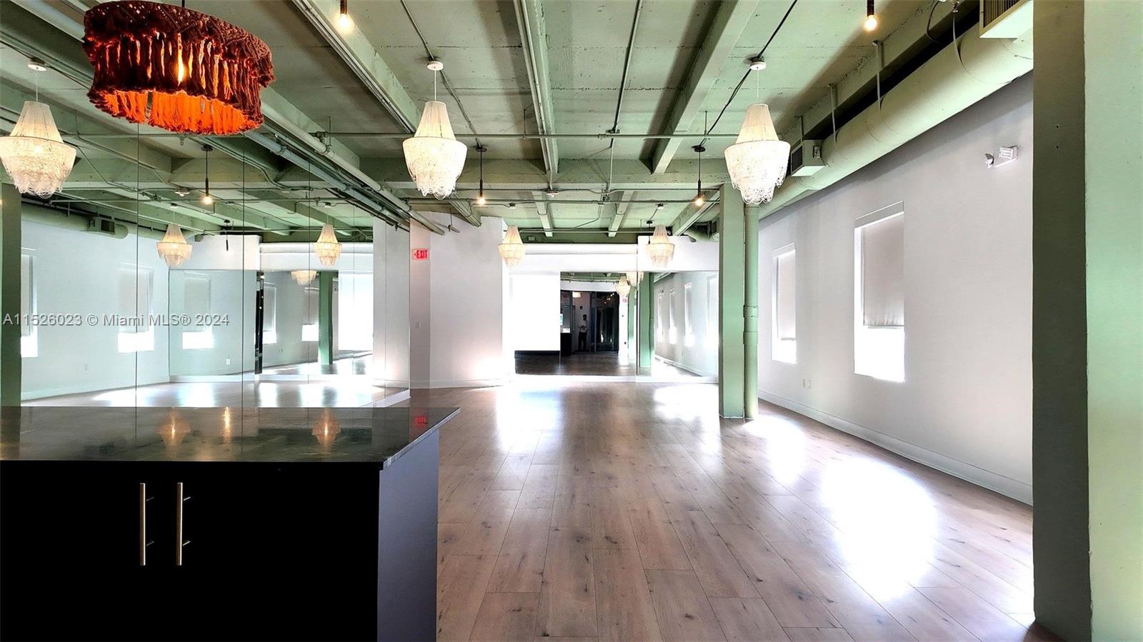 Private office for rent in Miami Beach's upscale Collins Park. Ideal for finance, design, or creative workspace. Steps from the ocean, W & One Hotels, and The Bass museum. Features natural light, shared patio, private restroom, shower, and ground floor restaurant.