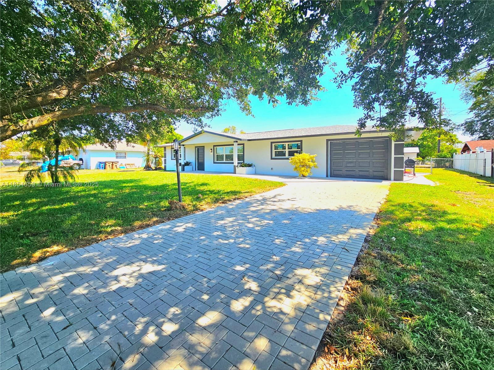 Stunning Fully Renovated Pool Home in Prime Lehigh Acres Location! Enjoy the best of Florida living in this beautifully updated home featuring city water and a brand-new roof. Step inside to a bright, open layout with large-format porcelain tile throughout, modern plumbing and electrical fixtures, and elegant upgraded baseboards and trim. The designer kitchen boasts sleek quartz countertops, brand-new stainless steel appliances, and contemporary finishes that blend style and functionality. This move-in-ready home is perfect for relaxing or entertaining—just bring your personal items and make it yours!