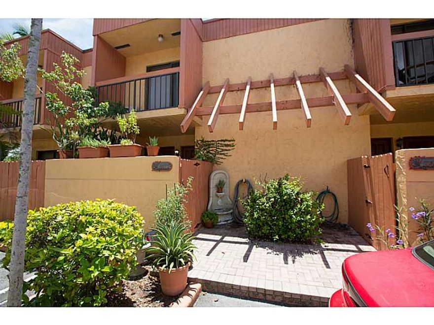 Grove Paradise Condo! Beautifully remodeled 2 bed/2.5 bath Townhome in Center Grove. Gated Community, 2 parking spaces, marble and wood floors, California closets, 2 balconies, secluded patio with Jacuzzi, stainless steel appliances, Granite Counter-Tops,  Washer & Dryer. Walking distance to  Supermarkets, Restaurants, Shopping, Public Transportation, Coconut Grove Metro-rail and US1. Pets up to 30 LBS ONLY. PRICE IS FIRM.