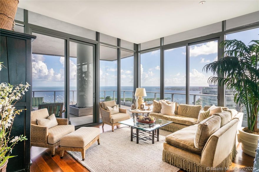 Elegant 2 story 7,061 sq ft Penthouse with expansive 5,216 total sq ft terraces and soaring ceilings - providing unrivaled panoramic views of Marinas, Biscayne Bay and the City. Private elevator foyer and grand Nautilus shaped stairs introduce rare private Roof Top Terrace complete with barbecue area and full air conditioned bar area. Designed by architect Jenifer Briley. Master Suite is complimented by 2 sitting rooms, double dressing area and massive bath. Gourmet kitchen includes European appliances, oversized island and multiple dining areas. This luxurious 4 bed, 3 full and 2 half baths Penthouse boasts additional library, den, formal living room and family room. 4 parking spaces included in sale. Located in the best full-service building in Coconut Grove – Grovenor House.