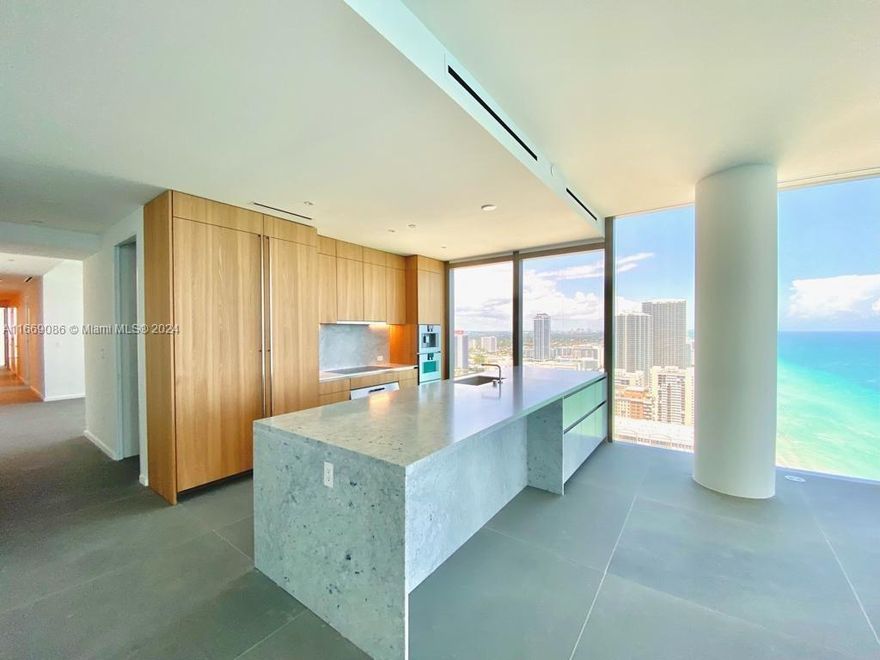 Introducing an exquisite oceanfront condo in a boutique luxury building, offering unparalleled elegance and resort-style living. Great Panoramic views from this unit, 3 bed 3.5 baths plus a den. This spacious unit features premium finishes, including Lualdi doors, stone flooring, and Boffi-designed kitchen equipped with Gaggenau appliances. The closets are custom-made by B&B Italia, ensuring sophistication and functionality throughout. Residents enjoy access to two pristine pools, beach and pool services, and a range of top-tier amenities. With stunning ocean views and refined design elements at every turn, this is the ultimate in high-end coastal living.