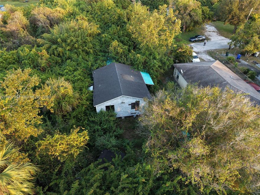 PLEASE READ ALL REMARKS. The aerial pictures are current. The rest of the pictures are for reference on how the house looked when it was purchased. Feel free to see it. No appointment needed. Property should have public sewer. 2Bed 1Bath with Living Room, Kitchen, Inside Laundry Hook Ups and Covered Front Porch. Needs Exterior & Interior Work. Please drive by and go see it. No direct access, it is surrounded by trees. Please park the closest possible and get the closest you can to see it. See the drone pictures for reference of the location of the home. Only offers at asking or over.