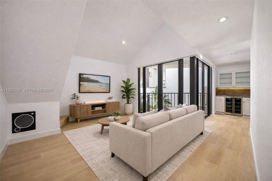 Rare 1 Bed / 1 Bath + LOFT (functions as a 2nd room/space) in a boutique 13-unit Mediterranean/Santorini-inspired gated enclave in the heart of Coconut Grove, EAST of US-1. Offering 777 sq.ft. of living area (per appraiser, larger than tax roll), this unique home is 1 of only 3 units featuring vaulted ceilings and a LOFT—creating exceptional volume, abundant natural light, and a living experience that lives far larger than its footprint. The LOFT provides an ideal space for a home office. Thoughtfully upgraded with high-end finishes throughout, including new neutral-tone flooring, custom staircase, spa-inspired multi-head shower, Elfa closet systems, and motorized shades. The spacious kitchen features granite countertops, new stainless steel appliances, under-cabinet lighting, and a bar area with a dual-zone wine & beverage fridge. The bathroom is finished in travertine marble and showcases a fully enclosed multi-head shower with 8 adjustable showerheads (4 ceiling-mounted, 4 body sprays), along with a new quartz-top vanity and front-lit mirror/medicine cabinet. Front-load washer & dryer in unit. Includes 1 assigned covered parking space. Residents enjoy a private, gated setting with a POOL, an uncommon amenity among boutique Grove communities. Unbeatable location just 4 blocks from CocoWalk, steps from Milam’s Market & Home Depot, and 3 blocks from Flanigan’s - offering exceptional walkability to some of the Grove’s best dining, shopping, and lifestyle destinations.