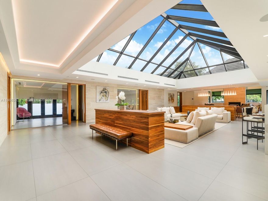 Welcome to the most sought-after property in the private community of Loch Lomond, Miami Lakes.  Everything about this estate on almost 1 acre of pristine landscape is on a stately scale, a truly trophy property in every sense of the word.  This impeccable residence greets you with an elegant foyer leading to an incredible atrium offering an abundance of natural light radiating throughout the entire floor plan with flow through yard views of the resort style pool and Don Shula’s famed golf course. Discover grand scale living & craftsmanship with 5 bedrms, 5 bathrms, Office, Media / Home theatre, Stone encased fireplace and a dedicated IT room and smart home features throughout.