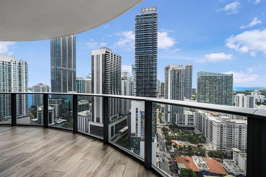Corner residence on the 29th floor of SLS Lux, a premier residential tower in the heart of Brickell, just steps from Brickell City Centre. This 01 line home offers 3 bedrooms and 4 bathrooms, a private elevator opening to a dedicated foyer, floor-to-ceiling glass with expansive city and bay views, and a wraparound balcony accessible from the main living areas.

The layout includes an expanded primary suite and a fully enclosed den currently configured as a laundry room, providing additional functionality and storage. The residence also includes attached storage and three parking spaces, two assigned spaces without lift plus one valet.

Interior features include developer upgrades throughout, WOLF appliances, marble countertops, Italian cabinetry, wine cooler, motorized blinds, smart lighting with voice control, and high-impact windows and doors. The home has been meticulously maintained by its owners and has never been rented.

SLS Lux offers resort-style amenities including multiple pools with cabanas, spa with steam rooms, fitness center, tennis court, mini golf and multi-sport court, residents’ lounges, children’s playroom, BBQ areas, concierge services, valet, and 24-hour security.

Steps from Brickell City Centre, Mary Brickell Village, top restaurants, shopping, and entertainment, offering one of the most walkable luxury living locations in Miami.