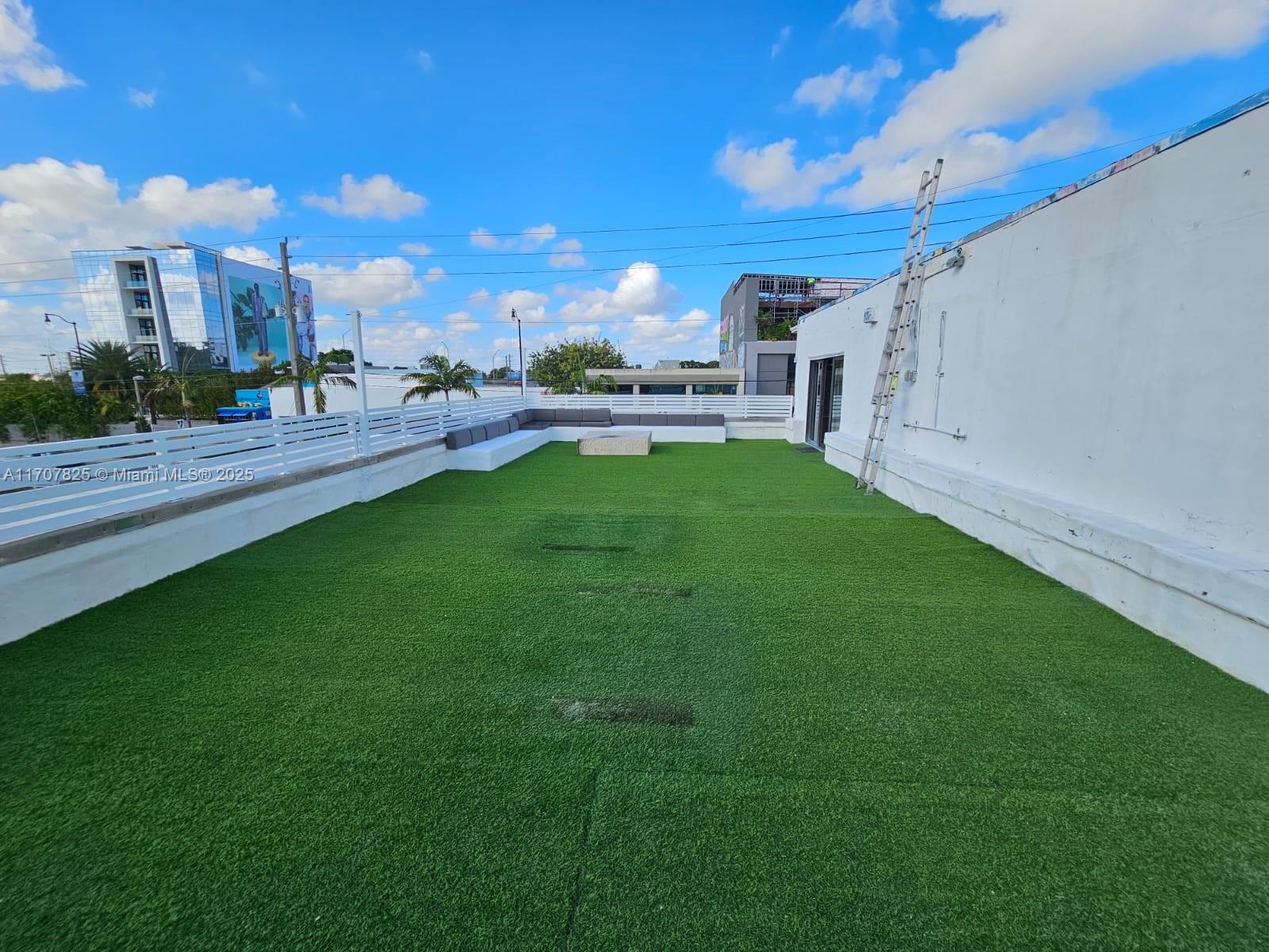 Located Wynwood/Midtown area with 3,946 sq/ft loft-style commercial space occupies the entire 2nd floor of a 2-story building. Features two open units, each with its own entrance, connected by a door for flexibility and ease of access, w/ 1,200 sq/ft private terrace. Includes 4 modern full bathrooms , polished concrete floors, exposed ducts, and abundant natural light, creating an ideal setting for creative professionals & collaborative workspaces. The industrial-style kitchen is equipped with a stainless steel eat-in island, restaurant-grade stove/oven, perfect for hosting events or catering to business needs. 1 assigned off-street parking & plenty of guest parking. Rent includes electric and water. Unique space is perfect for a showroom, design studio, art gallery, or office space.