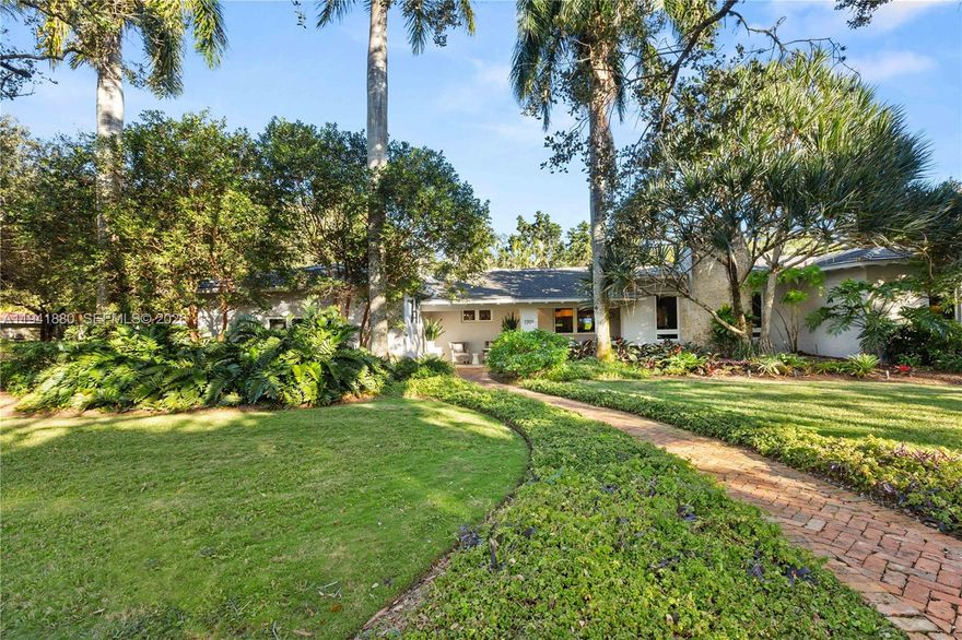 Immaculately maintained and updated home w/ 18,200 lot. Located on one of North Coral Gables’ most special streets. This updated 4BD/4BA plus 2 car garage home blends timeless charm with modern comfort—just steps from the Prado. A desirable split floor plan offers privacy and flexibility, anchored by a spacious ground-level primary suite. Sunlight pours into the bright, open family room, creating the perfect backdrop for everyday living and entertaining. Upgrades include impact windows and a newer roof for peace of mind. Outdoors enjoy true resort-style living with a private sauna, cabana bath, wet bar, oversized pool, and expansive yard surrounded by mature landscaping and fruit trees. A rare, turnkey North Gables gem in an exceptional setting.