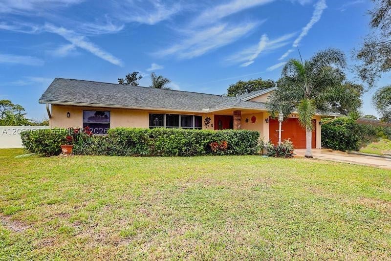 Photo of 412 SW Sansom Ln, Port St Lucie, FL 34953 (MLS # A12082617)