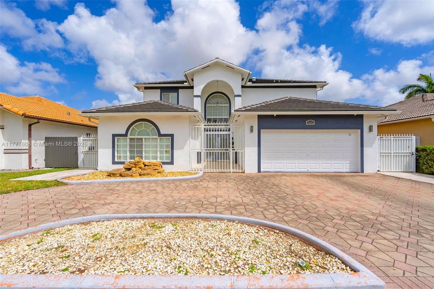 Renovated 6-bedroom, 4.5-bathroom single-family home in desirable West Kendall. This property offers two master suites one on each floor—with walk-in closets. Additional highlights include porcelain floors, a glass staircase, impact-resistant windows and doors, and a travertine-paved patio and sides with a pergola. Recent updates feature a new roof (2022), fence (2021), custom closets (2021), stainless steel appliances (2021), and an anti-blackout hurricane system. The wide circular driveway, camera system, and alarm enhance convenience and security. No association fees