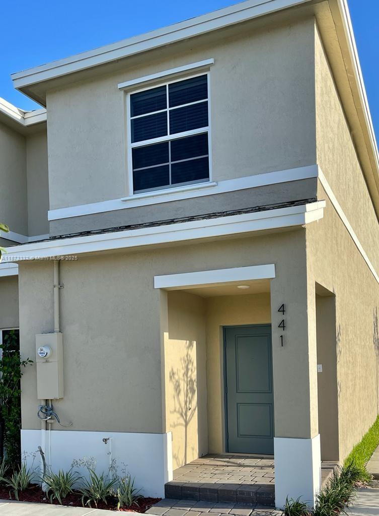 Modern 3-bedroom, 3-bath corner townhouse in Keys Pointe, built in 2020. This spacious and well-maintained home features tile flooring throughout the open-concept living and dining areas, a fully equipped kitchen with stainless steel appliances, and a convenient first-floor bedroom with a full bath—perfect for guests or in-laws. Upstairs, you'll find two generously sized bedrooms, each with its own ensuite bathroom, plus a large laundry room.. Enjoy outdoor living in the private, fenced backyard with a patio—ideal for gatherings. Community amenities include a resort-style pool, basketball court, and playground. Prime location near top-rated schools, shopping, dining, major highways, and just minutes from the Florida Keys. Low HOA and FHA/VA approved community