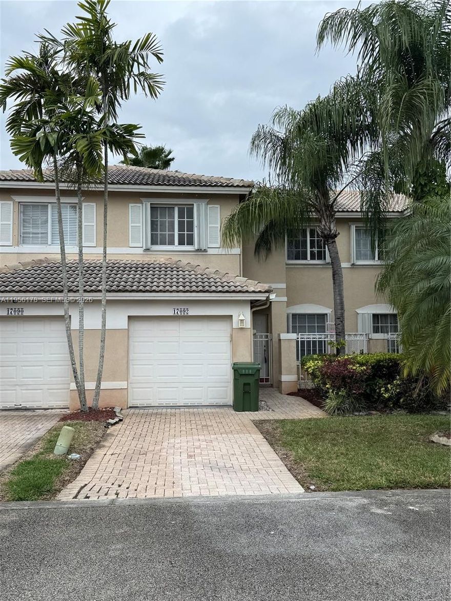 Beautiful townhome in a desirable community in Pembroke Pines. 24 hour guard gate, 3 pools, tennis & racquetball courts & more. Located near major highways & shopping centers. Accordion Shutters!, Stainless SteelS Kitchen Appliances, Washer and Dryer, Beautiful Crown molding. Tumble Marble Flooring/Carbonized Strand Woven Bamboo Flooring, Up Graded Kitchen Cabinets w/ Beautiful Granite Counter top. Great Floor Plan w/ half bathroom downstairs for guest. Enjoy resort-style living! Opportunity will not last!