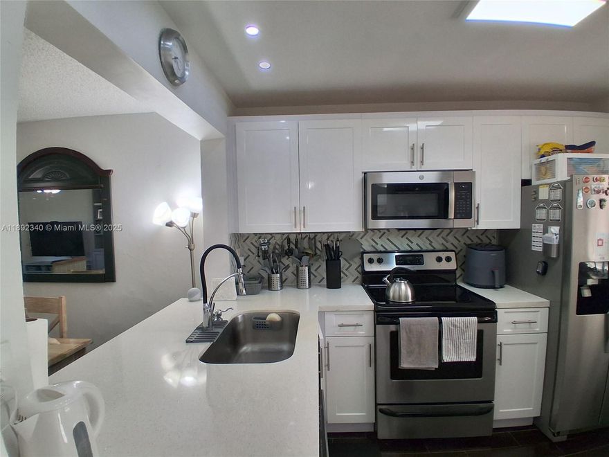 MUST SEE! Beautiful completely remodeled penthouse 2/2 condo in an active 55 + community with spectacular golf and lake view from your screened in balcony. White quartz countertops, stainless steel appliances, wood laminate floors throughout, large capacity washer and dryer inside the unit. Brand new screened in balcony. Extra storage. Amenities include WORLD CLASS CLUBHOUSE, golf, pool, jacuzzi, tennis, racquetball, movie theater, shows, concerts, dances, and much more. only 5 minutes to sawgrass mall and 20-25 minutes to Fort Lauderdale Airport, Cruise Liners and beaches.