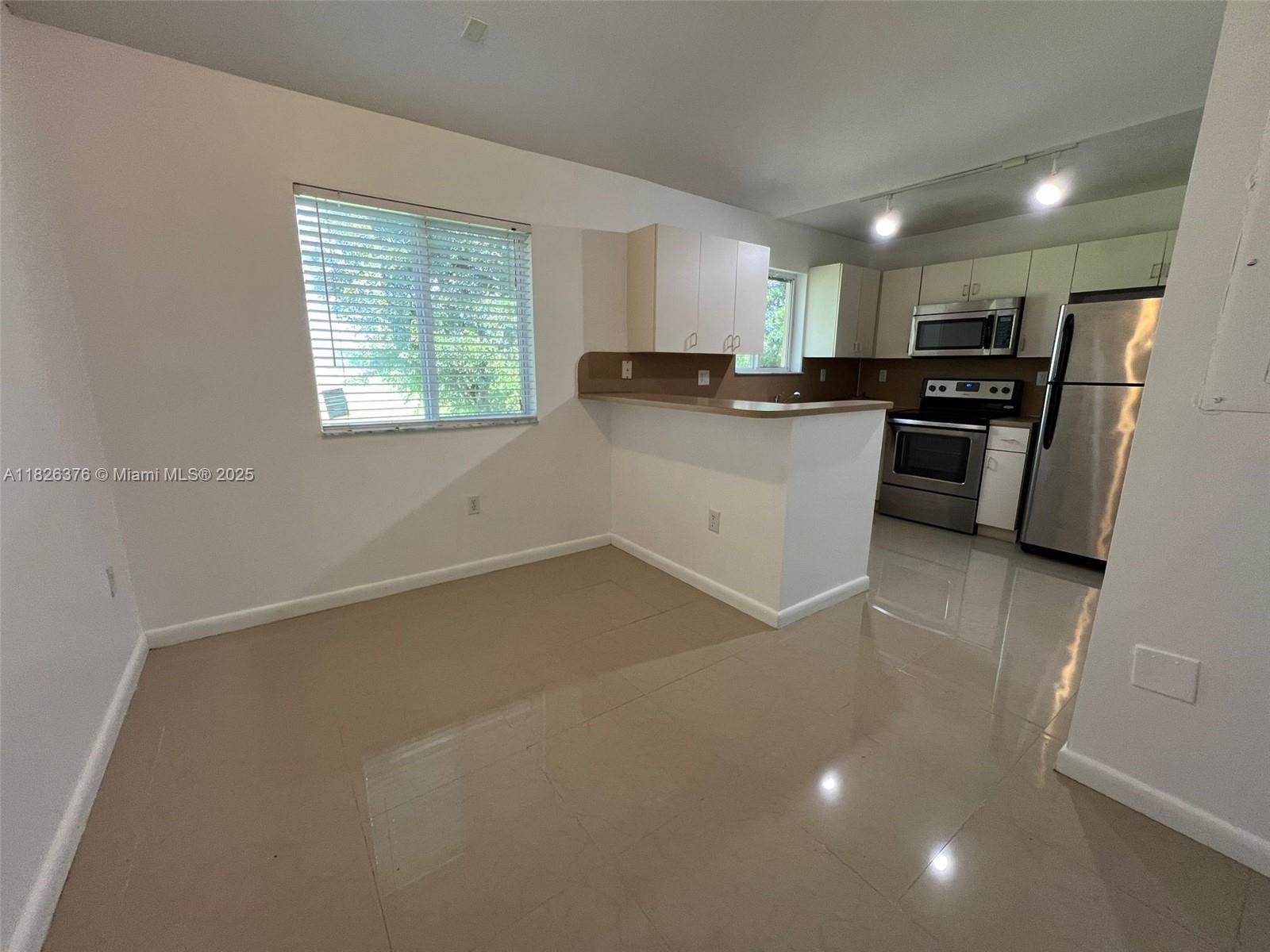 Beautiful Apartment! 3 bedrooms, 2 bathrooms in an impeccable gated community! Freshly painted. Upgraded tile floors throughout all rooms. Stainless Steel Appliances. Impact Windows! Walking Closet on Master Bedroom, Washer & Dryer inside the unit. One Assigned Parking. Guest parking. Gate with security guard. Well maintained common areas. Great clubhouse with swimming pool and gym. This community makes you feel in a beautiful resort! Second floor entrance. Easy to show! It will not last!