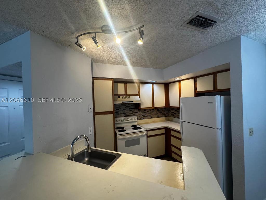 Photo of 3360 N Pinewalk Dr N #1324, Margate, FL 33063 (MLS # A12066610)