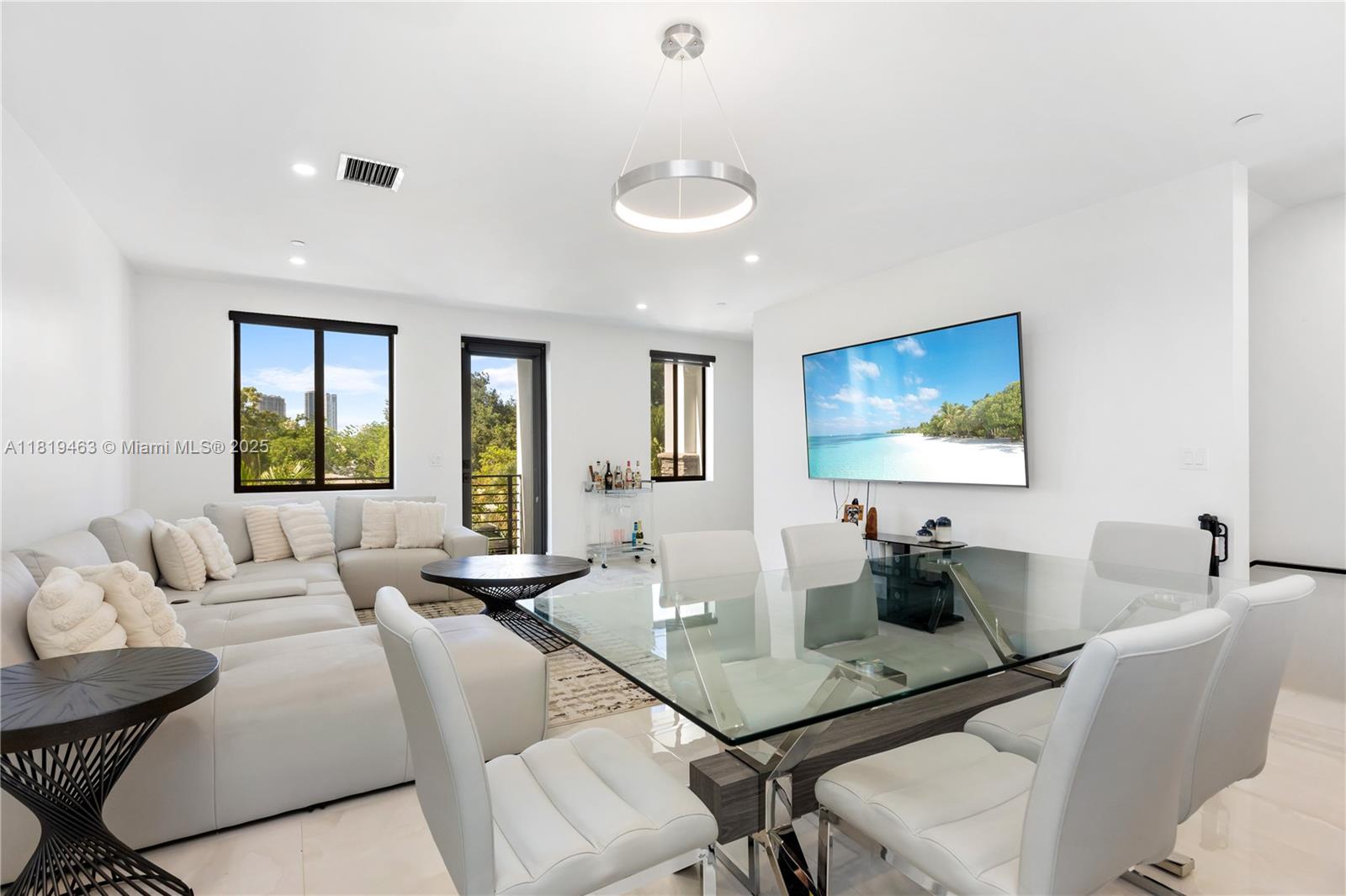 Step into modern luxury in this stunning tri-level home, built in 2023 and located in the highly sought-after Poinciana Park, just minutes from Las Olas, Downtown Fort Lauderdale, beaches, fine dining, shopping, and major highways. This spacious 3-bedroom, 3.5-bath residence offers the perfect blend of style, comfort, and functionality. Featuring a first-floor guest suite, gourmet kitchen with quartz countertops, elegant tile throughout, and sleek designer lighting. Each bedroom has a private en-suite bath, and the primary suite boasts double sinks and oversized custom closets. Enjoy natural light, a private balcony, and a 2-car garage, luxury living at its finest.