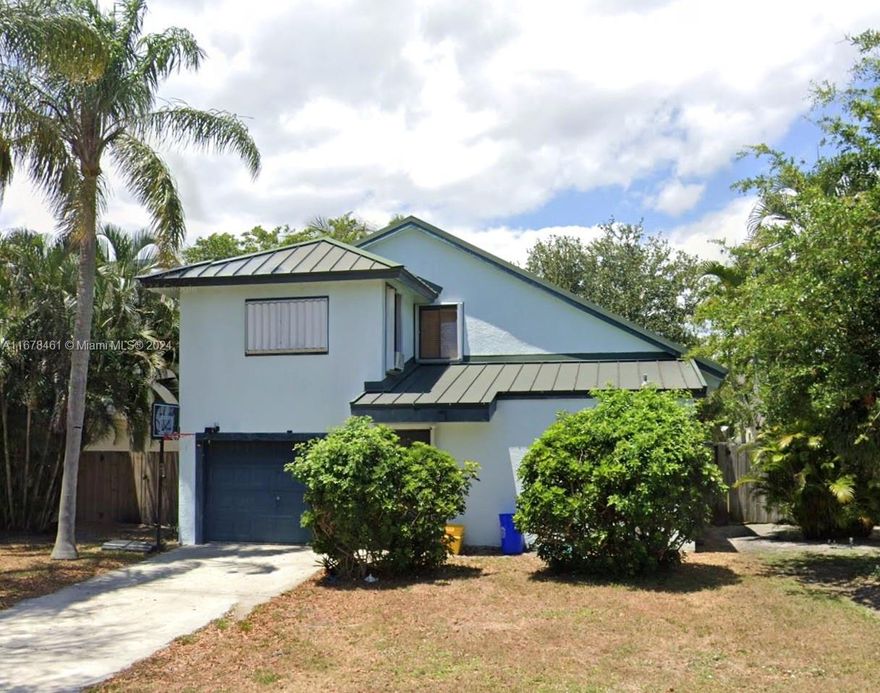 This charming 3 bedroom, 2 bath - 2 car garage home presents a prime opportunity to craft your dream space in highly sought after Delray Beach. Boasting classic open concept bones with vaulted ceilings, this solid structure is ready for your personal touch to unlock its full potential. Rare opportunity to live close to everything - just minutes from the beach and downtown Atlantic Ave. Quiet and safe neighborhood for a growing famliy, or capitalize on its strong income-generating potential with no HOA or restrictions.