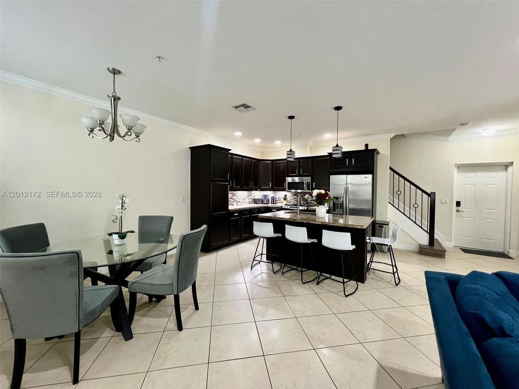 Photo of 3311 NW 125th Way, Sunrise, FL 33323 (MLS # A12012172)