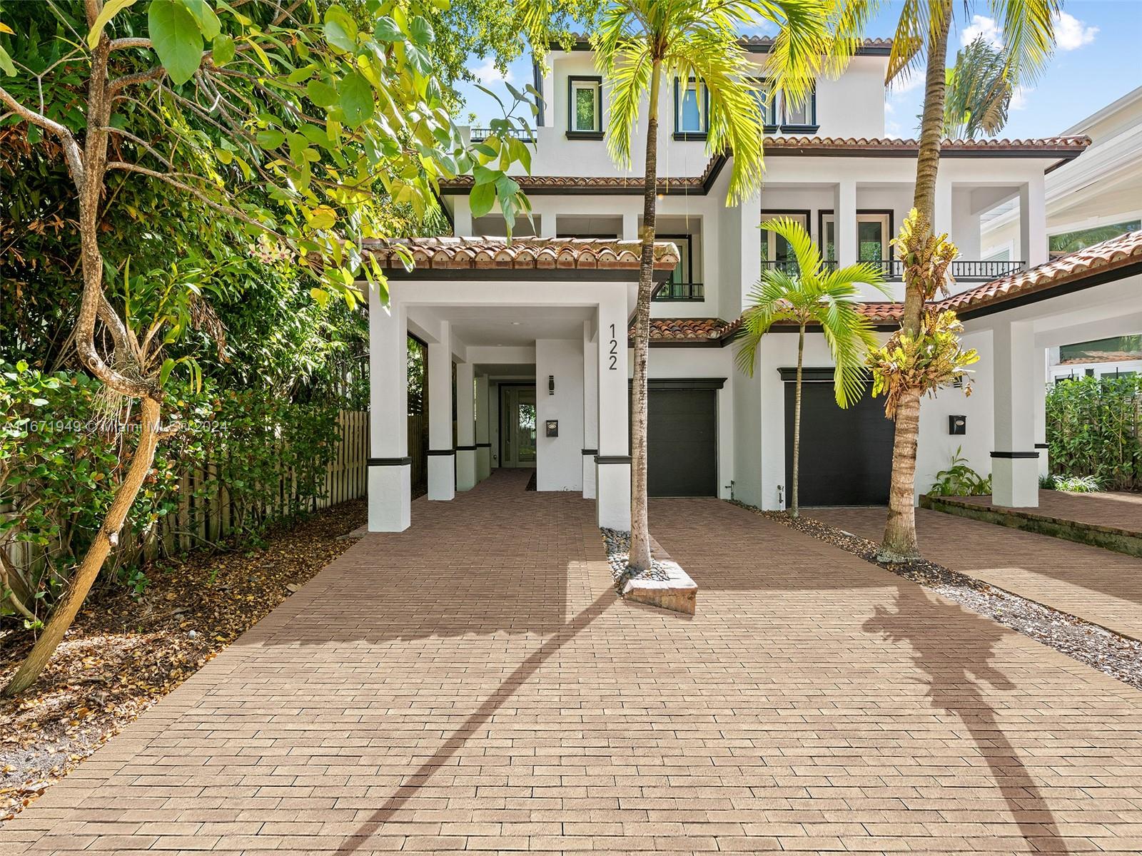 Beautifully renovated 3BR/4BA fee simple townhome on one of the loveliest streets in Victoria Park. Brand new roof installed 9/2024 and solar power being installed 10/24. This home has a private fenced backyard with artificial turf and a newly resurfaced pool and BBQ area for entertaining. All impact windows and doors. Elevator for all 3 floors. Each BR has an ensuite bath. Home is offered fully furnished. Please note that photo does not show brand new roof - photo to be updated - stay tuned!