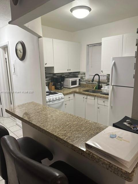 COZY 1BR FULLY FURNISHED COMES WITH EVERYTHING YOU NEED. SHOW AND RENT. TILE FLOORS ALL THROUGHOUT. OPEN-CONCEPT KITCHEN. LARGE WALK IN CLOSET. ONE ASSIGNED PARKING SPACE. BLDG PERFECTLY LOCATED IN THE HEART OF SUNNY ISLES & BETWEEN BAL HARBOR SHOPS AND AVENTURA MALL AS WELL AS MIAMI AND FORT LAUDERDALE INTERNATIONAL AIRPORT. HEATED POOL, LAUNDRY FACILITIES, WALKING DISTANCE TO THE BEACH, SHOPS, RESTAURANTS. FULLY FURNISHED. ALL THE UTILITIES INCLUDED: INTERNET, CABLE, ELECTRICITY AND WATER). AVAIL NOW FOR A YEAR OR SHORT-TERM LEASE. FIRST- AND ONE-MONTH SECURITY DEPOSIT TO MOVE IN. NO PETS.