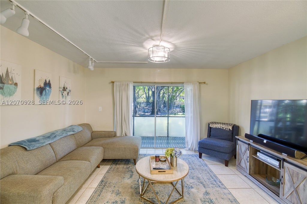 Photo of 3095 N Oakland Forest Dr #104, Oakland Park, FL 33309 (MLS # A12070928)