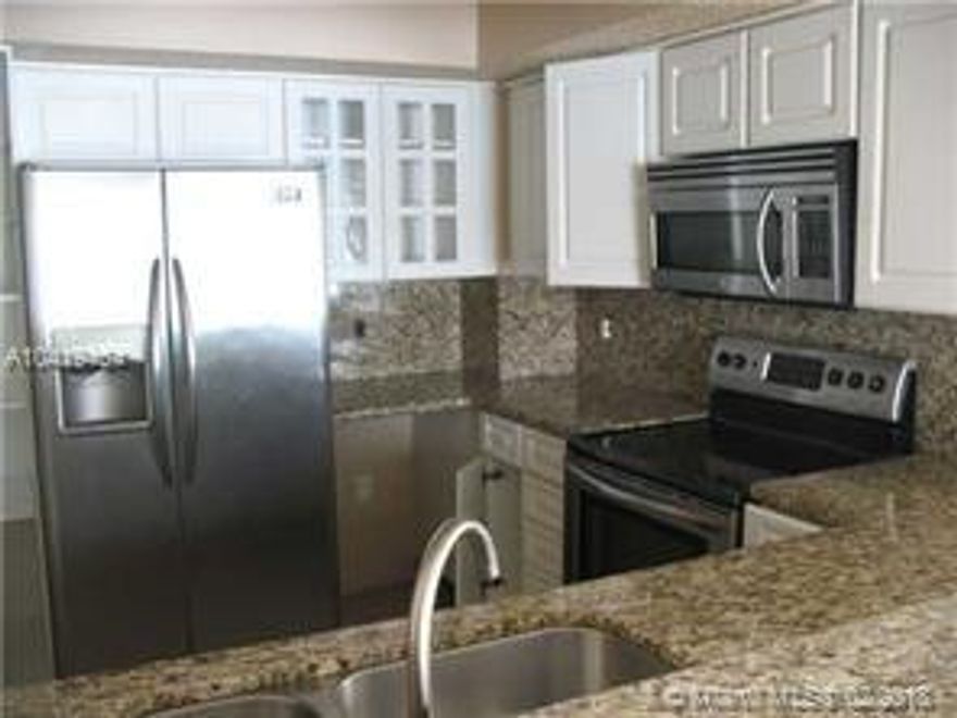 Charming 2 bedroom 2 bathroom condo in the heart of the Hammocks. Updated kitchen with granite counter&#xD;&#xA;tops & stainless steel appliances. Spacious master with walk in closet. Tiled throughout. Private, screened&#xD;&#xA;balcony with full size washer and dryer. Complex is gated. Access to Hammocks amenities. In addition,&#xD;&#xA;complex has a pool, gym, clubhouse and security. Centrally located.
