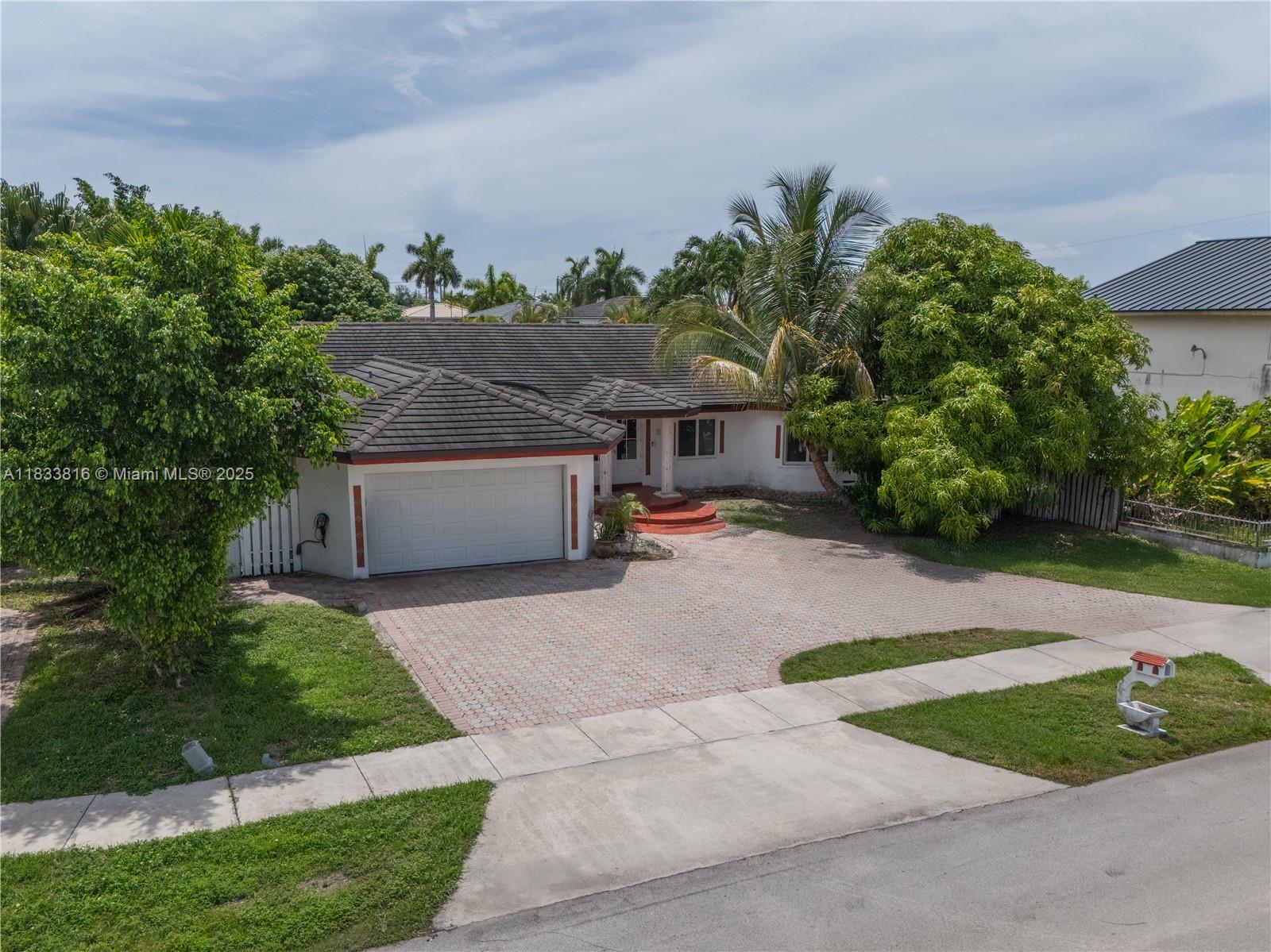 PRICED TO SELL UNDER APPRAISED VALUE WITH LARGE LOT AND NO HOA RESTRICTIONS! Offers high-end improvements and unmatched value in today’s market. PERMITTED 400-amp ELECTRICAL PANEL with individual breakers for Tesla charging, A/C units, and pool. COPPER WIRING from transformer to home (over $23,000 in electrical upgrades). 2020 ROOF Category 5-rated, IMPACT WINDOWS & DOORS, SALTWATER POOL with a 2021 salt generator still under warranty. THREE SEPARATE A/C UNITS, including AIR-CONDITIONED GARAGE with EPOXY FLOOR perfect for a gym, workspace, or car enthusiast. TESLA CHAGER PLUG conveys. Conveniently located, COMPETITIVELY PRICED, and built for today’s discerning buyer. Taxes Reflect PACE to be paid at closing. MORE PHOTOS COMING SOON!