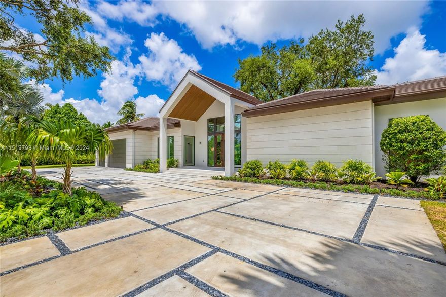 NEW CONSTRUCTION 8,003 TOTAL SQ FT. This spectacular construction home in this hidden gem neighborhood boasts seven beds & 6 baths, providing ample space for a large family or guest. The house's centerpiece is the massive open kitchen equipped with top-of-the-line appliances, ensuring a delightful cooking experience. For wine enthusiasts, a dedicated wine room is incorporated into the design. The house features a three-car garage for convenient parking. Entertainment options abound in this property as the enormous terrace has a fully loaded summer kitchen, adding a natural serenity and privacy to the outdoor oasis.