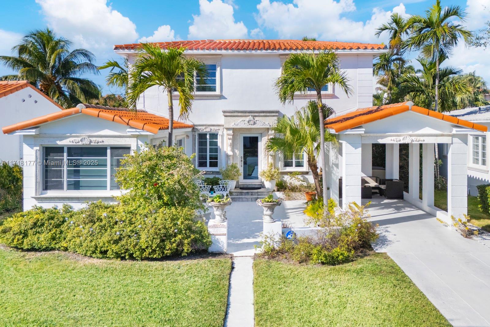 Just steps from Miami Beach and walking distance to Houses of Worship, this renovated 1940s home blends historic charm with modern living. Original oak floors have been preserved, offering timeless character that’s rare to find in today’s homes. The spacious kitchen has double ovens and sinks, perfect for cooking and entertaining. With impact windows and a smart two-story layout, the home offers both style and practicality. The expansive backyard—one of the largest in Surfside—offers incredible space, a rare find in this sought-after neighborhood. Buyers can easily blend the home’s classic charm with contemporary furnishings to create a space that feels straight out of a design magazine. Nearby amenities include the Surfside Community Center and the Miami Beach boardwalk.