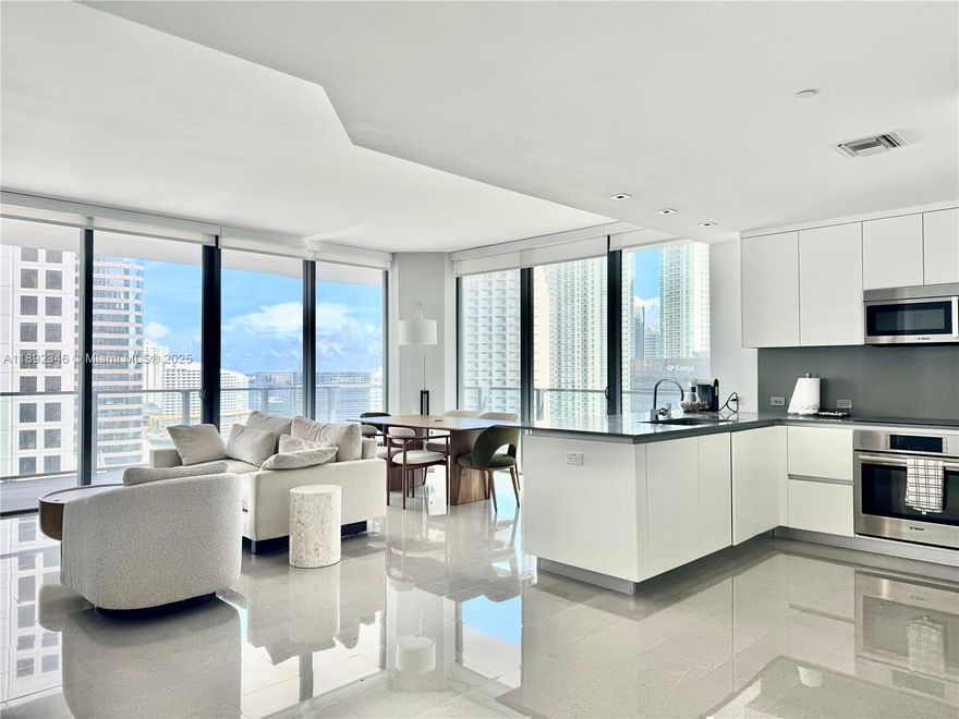 Incredible corner unit available at Reach in Brickell City Centre. 12ft ceilings, two bedrooms, and two full bathrooms, an exceptional layout. The living room and master bedroom are furnished with new model-style furniture. Large balconies offer stunning city views from both sides. Great location. Enjoy extensive shopping and dining options within Brickell City Centre. The building boasts hotel-like amenities, including a pool, spa, gym, kids' club, concierge service, and valet parking.