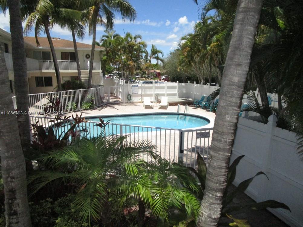 Welcome to this charming 1 bedroom, 1 bathroom home, perfectly situated on the first floor with a magnificent pool view. Nestled in a quiet and desirable neighborhood in the heart of Fort Lauderdale, this residence offers both convenience and comfort. Just one block from US-1, and 1.8 miles from the beach, and near Holy Cross Hospital, the location is truly unbeatable. Freshly painted interiors, Modern Kitchen with stainless steel appliances, sleek cabinetry and tile flooring throughout, bathroom in excellent condition, impact windows and doors for added peace of mind. A/C and water heater in great condition for year-round comfort and efficiency. The community offers wonderful amenities, including a heated pool common laundry facilities. Assigned paring spot just steps from unit