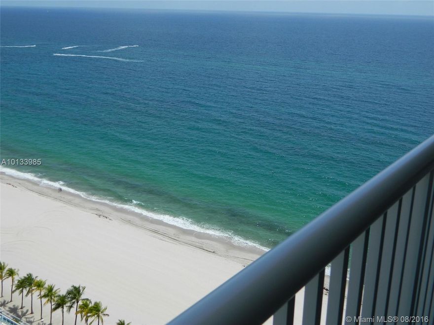 Completely renovated and tastefully decorated large 2/2 located in a luxury Beach front Building.  Excellent Ocean and Intracoastal views.  Furnished with King bed in master and has a Queen Murphy bed in guest which opens to the living room and is ideal for company.  Master bedroom has a massage chair and beautiful corner windows w/ views.  Impact windows, Washer and dryer inside unit, and garage parking.  Brilliant tile floors throughout, Granite counters, and just recently painted inside. 6 month min.