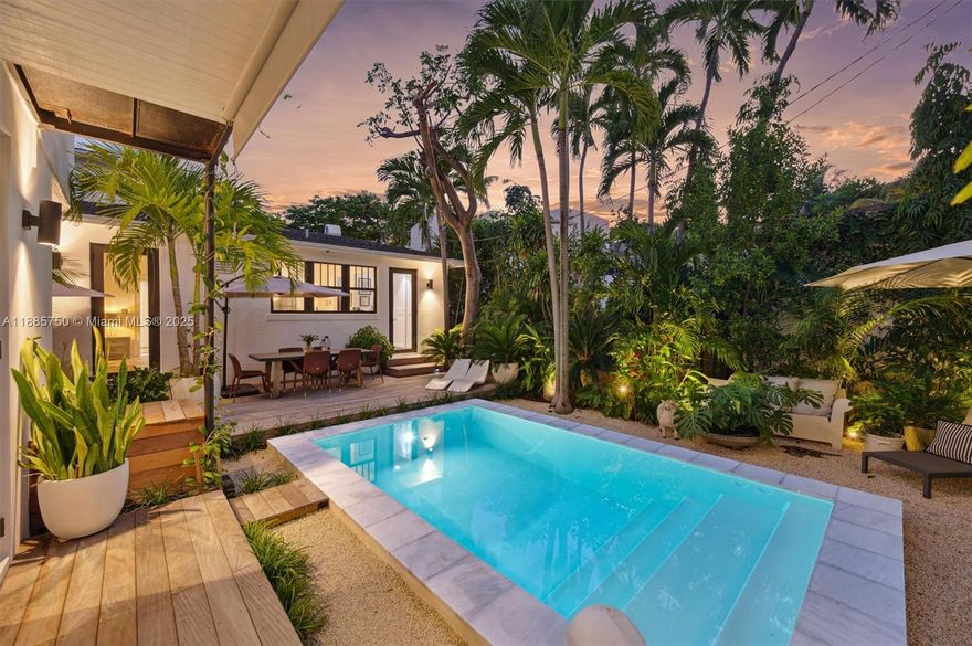 Welcome to ‘Casa Lumina’ a century-old Buena Vista East estate transformed into a modern masterpiece. With 3,400 SF, 5 beds & 4.5 baths, this fully renovated home blends historic charm with luxury upgrades. The main residence offers 3 beds, 3 baths incl a rare first-floor primary suite. Original Miami-Dade pine floors, wainscoting, hurricane-impact windows & a chef’s kitchen. An oversized versatile detached 2 story dwelling offers a two-bed residence with private entrance, kitchen, laundry, living room great for family, guests, or income. Downstairs ideal for a lounge, office or retreat opening to a saltwater pool, Ipe deck's & lush landscaping, creating a private resort oasis. Elevated 16 ft in a no-flood zone & steps from the Design District, this is an entertainer’s Miami dream.