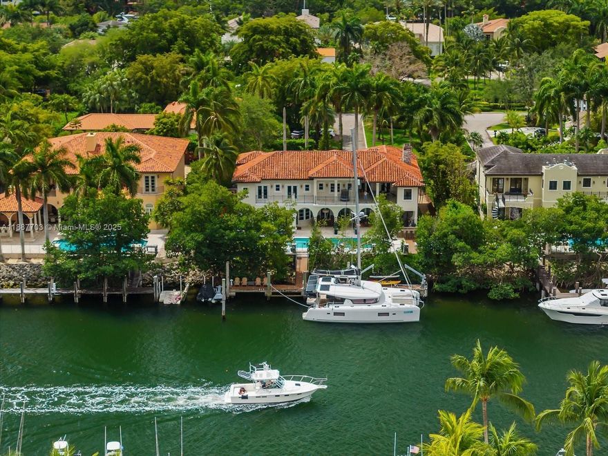 Step into luxurious waterfront living with no bridges to the bay and direct ocean access. This elegant two-story residence, fully updated in 2022, is set on a private cul-de-sac with 108 ft. of water frontage. A grand foyer opens to formal living and dining rooms, a spacious eat-in kitchen, and a family room. Features include a guest and maid’s room, two-car garage (one with lift), and laundry room. Upstairs offers four ensuite bedrooms, including the primary suite with office and terrace. Outdoor highlights: summer kitchen, heated saltwater pool, cabana bath, dock with lift, jet ski floats, and half basketball court. Located in Islands of Cocoplum with 24/7 security, clubhouse, and tennis courts.