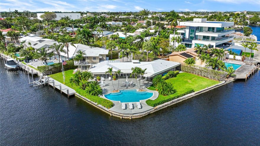 Spectacular find in prestigious Laudergate Isles. Ocean access corner point lot on Middle River, 252 ft. waterfront. Outdoor paradise, thoughtfully designed patio ideal for outdoor gatherings, relaxation, & al fresco dining. Enjoy the Florida sunshine, southern breeze, & infinite N, E & S river views. House sits on 39 pilings, 65 ft deep, 13 for the heated pool, with spa bench, jets & fountains. Wet bar, wine cooler. Jacuzzi in master bath, steam shower, dual vanities, bidet. Blackout shades in media room. Hunter Douglas shades. Tempered safety glass. REME HALO air purification. Alarm, cameras, electric gate, boat lift. Ideal for builders or end users. Highly sought-after neighborhood, enjoy city living, surrounded by water, lush greenery and a peaceful atmosphere