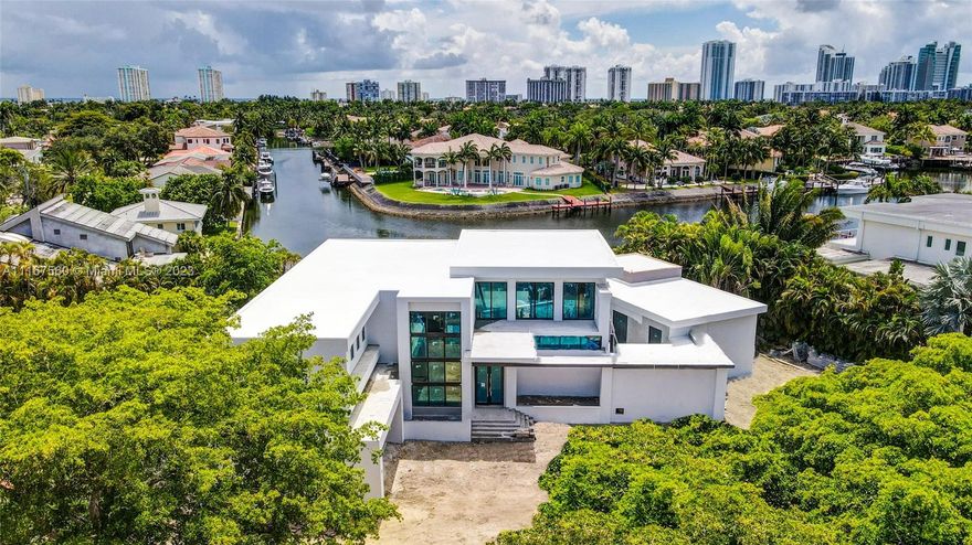 Spectacular waterfront 19,431 SF lot on prestigious DiplomatParkway with 115FT of water frontage. 184FT street frontage. New custom built waterfront estate. 7300 SF. 6 bedrooms. 7 bathrooms. 3 car garage. Home to be completed by August 2023. Walking distance to the new Shell Bay Golf, an Auberge Resort by Witkoff Group. Greg Norman designed Golf Resort. One mile north of Golden Beach.